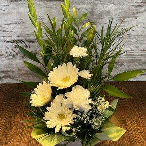 Box arrangement in fresh white flowers including gerberas, sim carnations, gladioli with baby's breath.