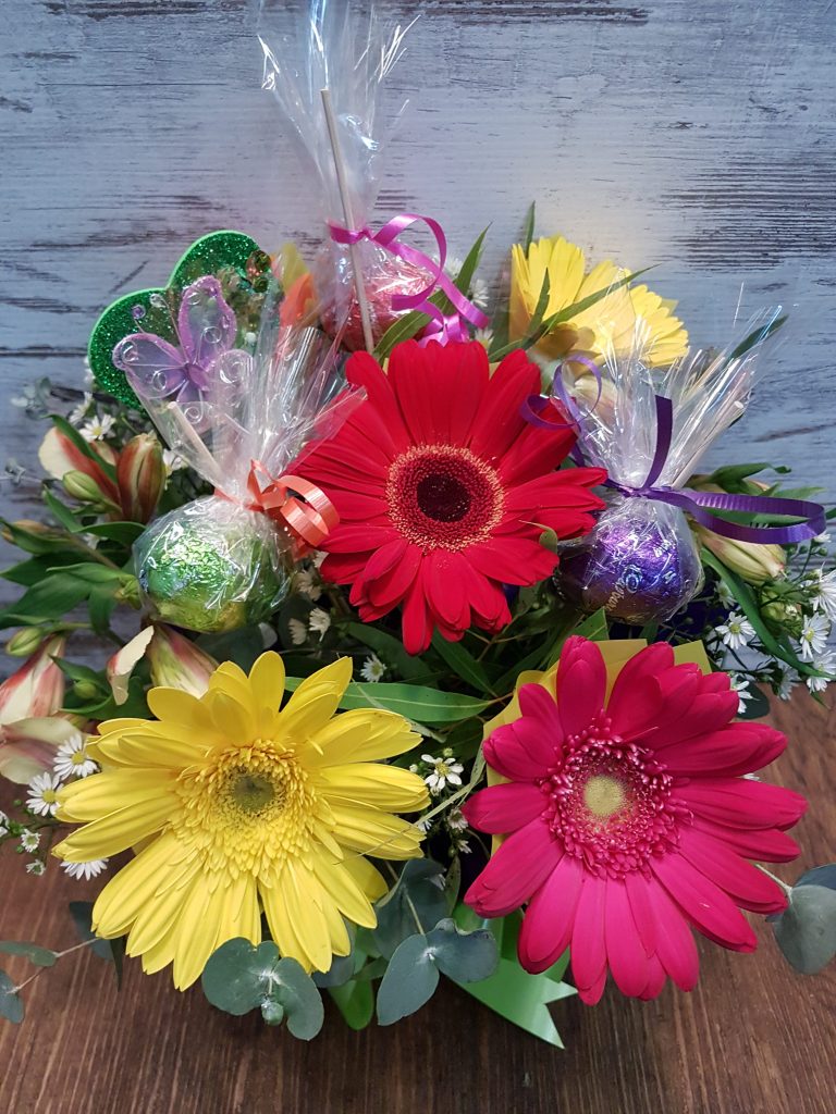 Easter gift flowers and chocolate eggs