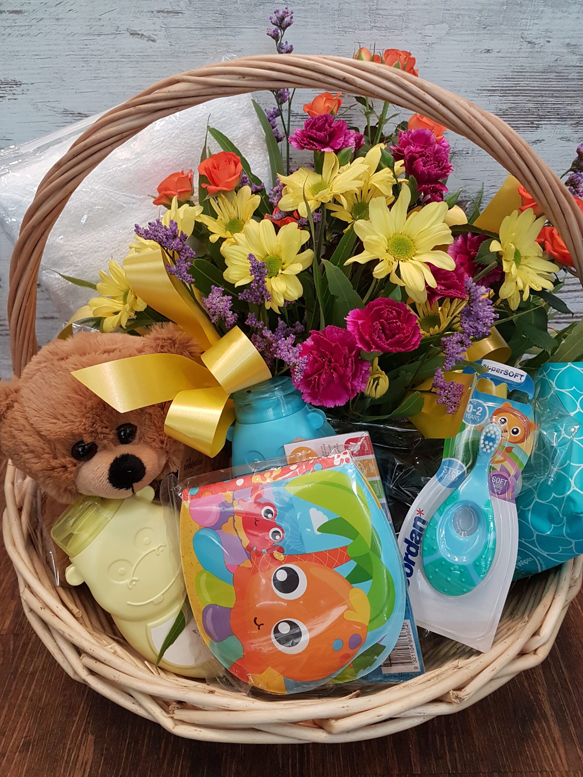 Gift basket of flowers and baby products