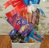 Sweet treat gift hamper are jams, biscuits, chocolate, teas, coffee and wine.